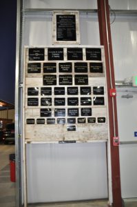 A wall with a section dedicated to plaques.