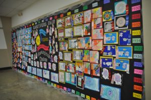 Wall of Artwork celebrating 90 years of home town traditions.