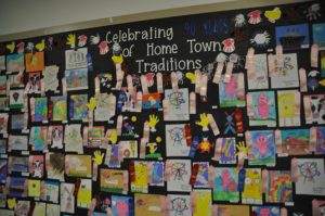 Wall of Artwork celebrating 90 years of home town traditions.
