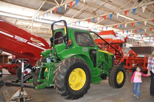 green tractor at the farm equipment exhibit