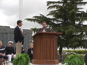 A man giving a speech on a podium.