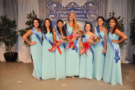 group of girls with sashes and bouquets of flowers