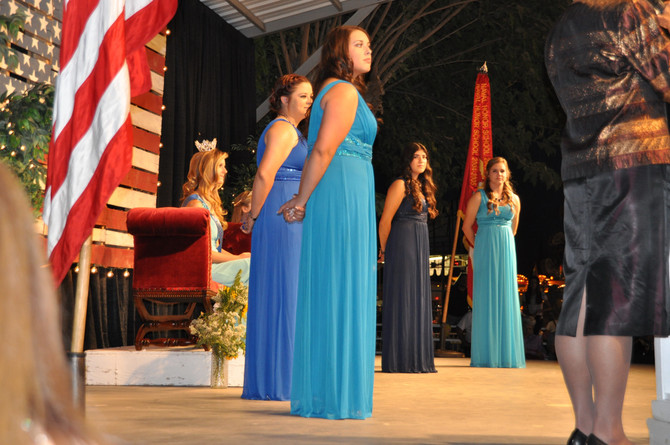 side view of girls standing on stage