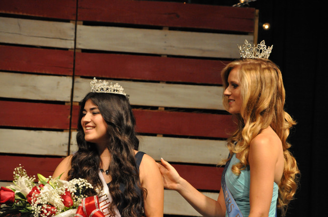 two girls on stage with crowns