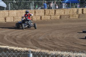 racer driving atv on the track