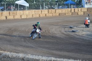 racer driving motorcycle on the race track