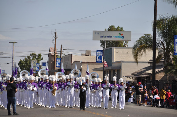 marching band playing and marching in the parade